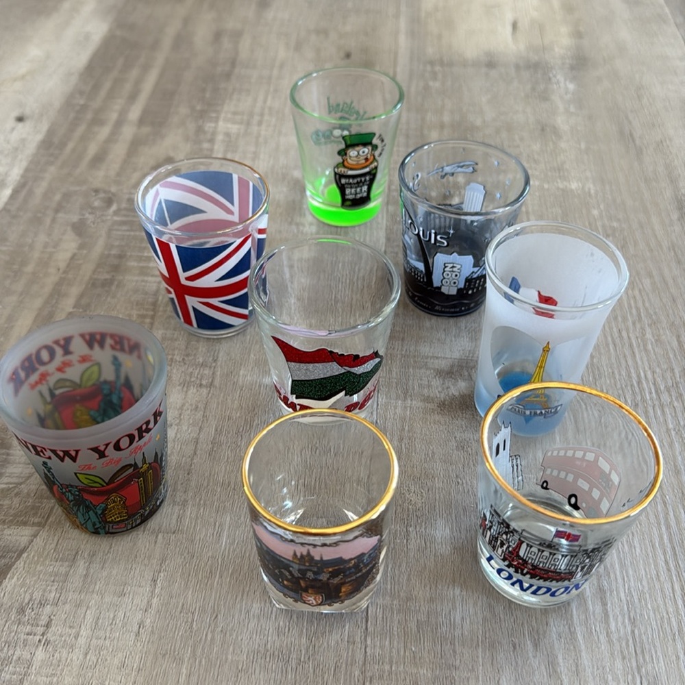 Set of 8 random city shot glasses
